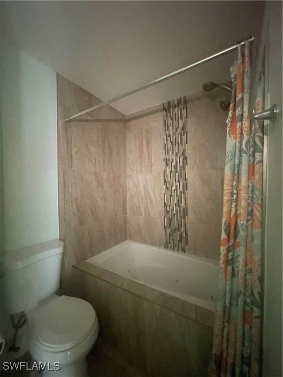 bathroom with shower / tub combo with curtain and toilet