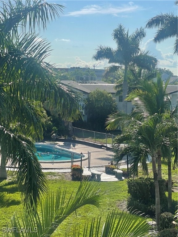 view of pool featuring a yard