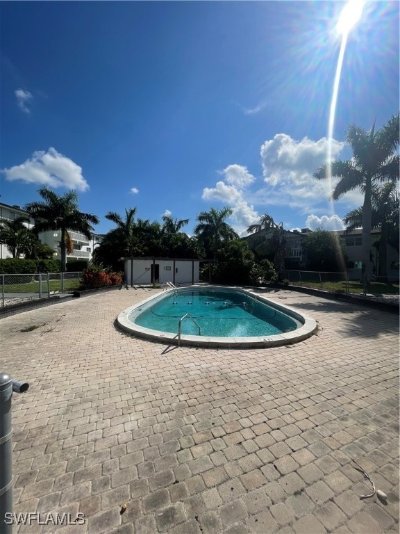 view of swimming pool with a patio