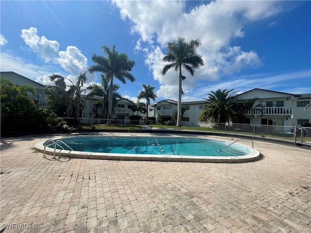 view of swimming pool with a patio