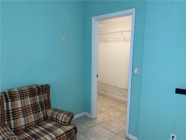 unfurnished room featuring light tile flooring