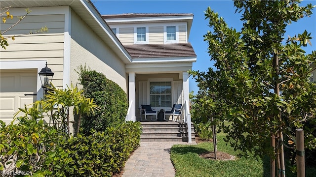 property entrance with covered porch