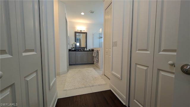 hall with light hardwood / wood-style floors