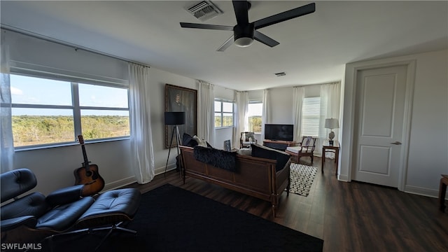 home office featuring dark hardwood / wood-style flooring and ceiling fan