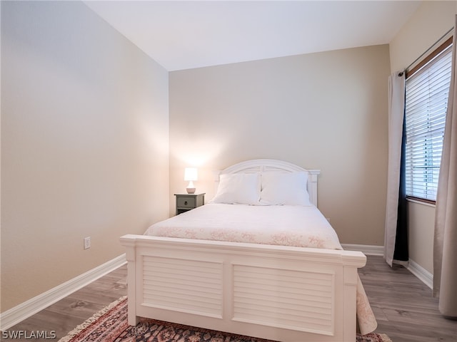 bedroom featuring dark wood-type flooring