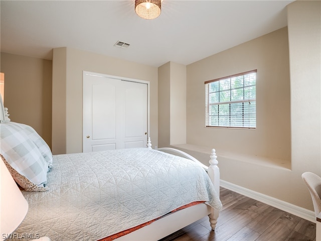 bedroom featuring a closet and hardwood / wood-style floors