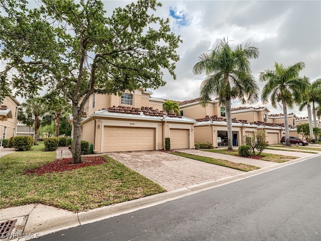 mediterranean / spanish-style house featuring a garage