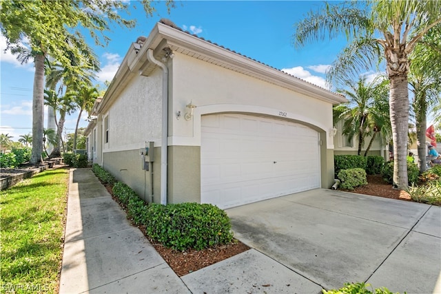 view of side of property with a garage