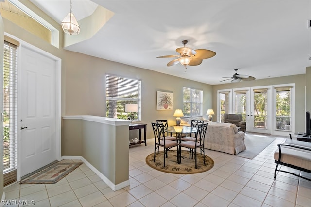 tiled dining area featuring ceiling fan