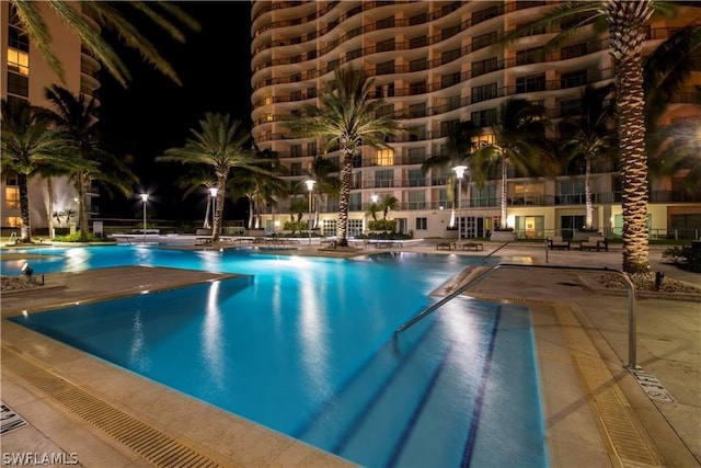 view of pool at night