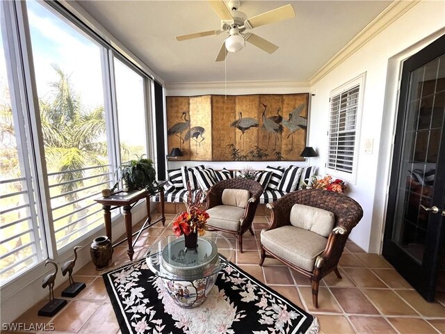 sunroom with ceiling fan