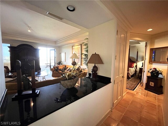 interior space featuring light tile patterned flooring and ornamental molding