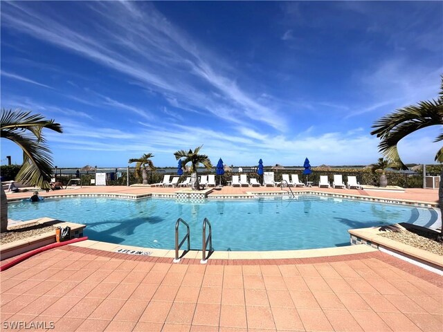 view of swimming pool with a patio area