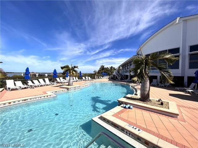 view of swimming pool with a patio