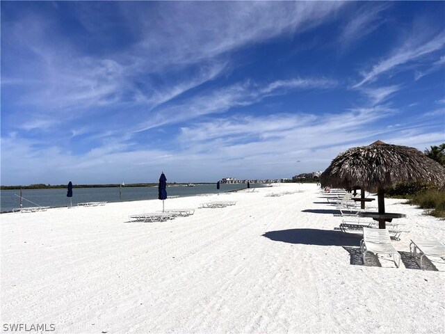 exterior space with a water view and a view of the beach