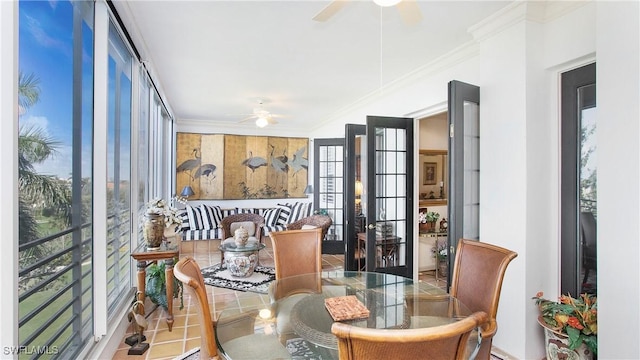 dining room featuring ornamental molding, ceiling fan, and french doors