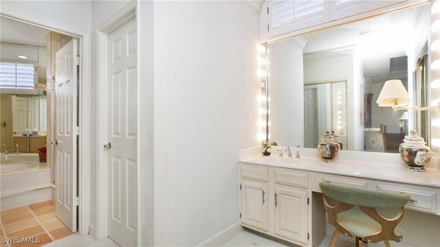 bathroom with vanity and crown molding