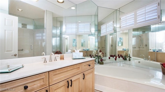 bathroom featuring vanity and plus walk in shower