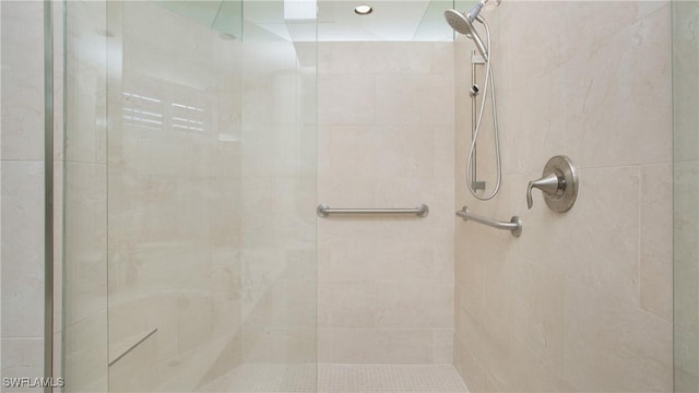 bathroom with a tile shower