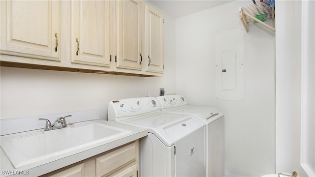 laundry room with cabinets, sink, electric panel, and independent washer and dryer