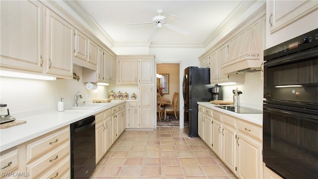 kitchen with sink, crown molding, ceiling fan, cream cabinets, and black appliances