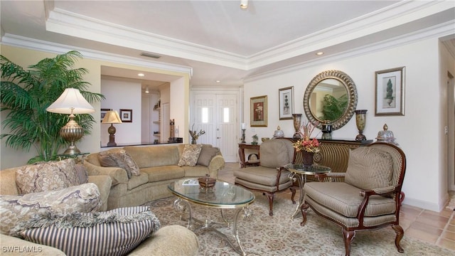 living room with crown molding, a tray ceiling, and light tile patterned floors