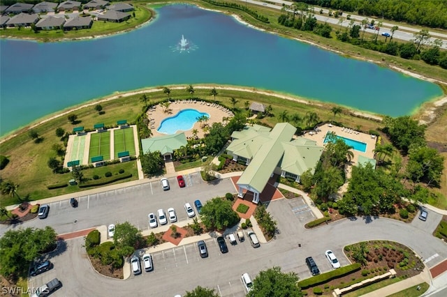 birds eye view of property with a water view