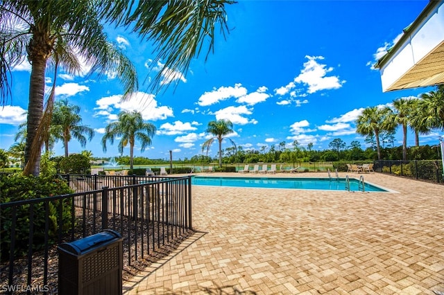 view of swimming pool featuring a patio area