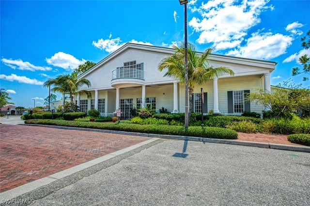 view of front of home with a balcony