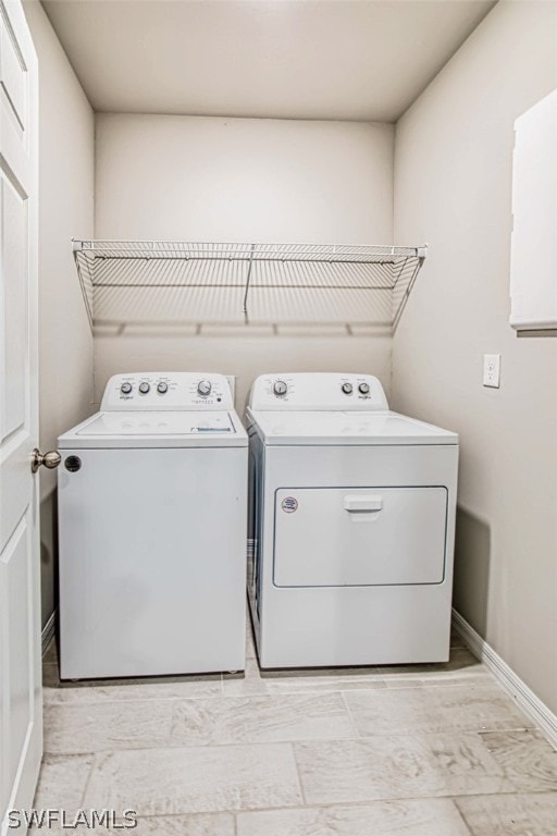 clothes washing area featuring washing machine and dryer