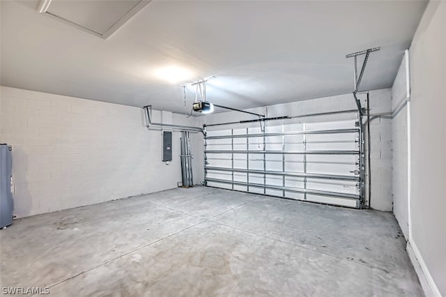 garage featuring a garage door opener, electric panel, and water heater