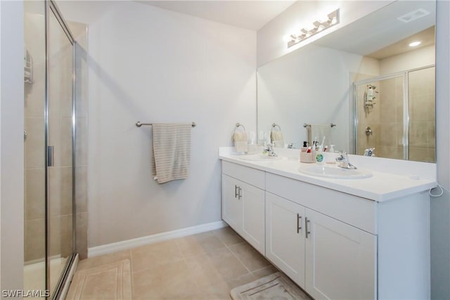 bathroom with vanity, tile patterned floors, and walk in shower