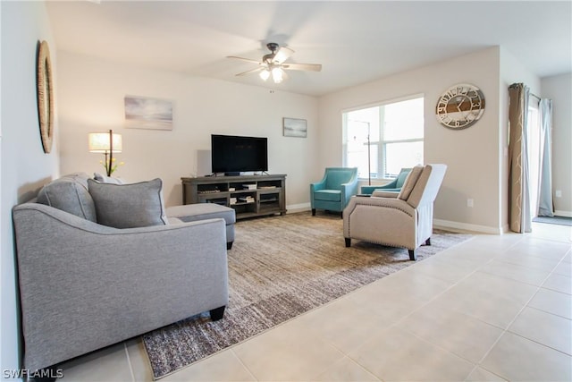 tiled living room with ceiling fan