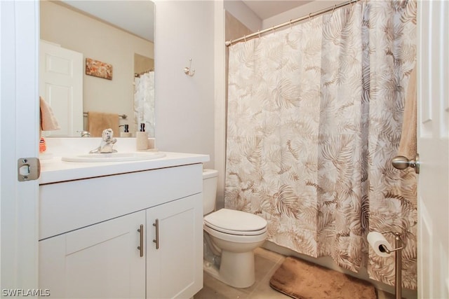 bathroom with vanity, tile patterned floors, and toilet