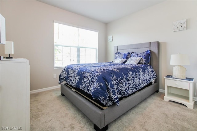 bedroom with light colored carpet