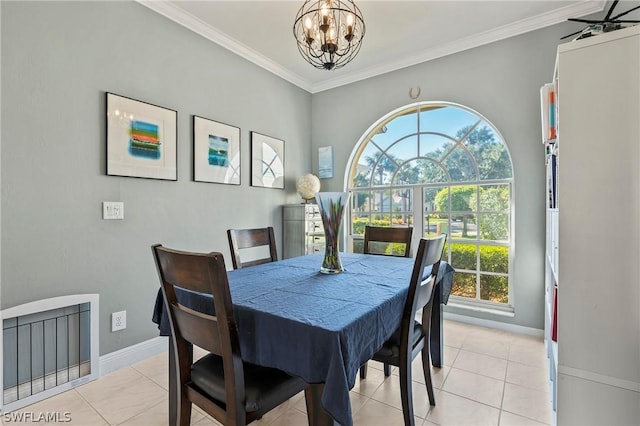 dining space featuring ornamental molding, light tile patterned floors, a healthy amount of sunlight, and a notable chandelier