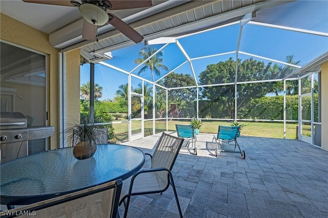 view of patio / terrace featuring a lanai and ceiling fan