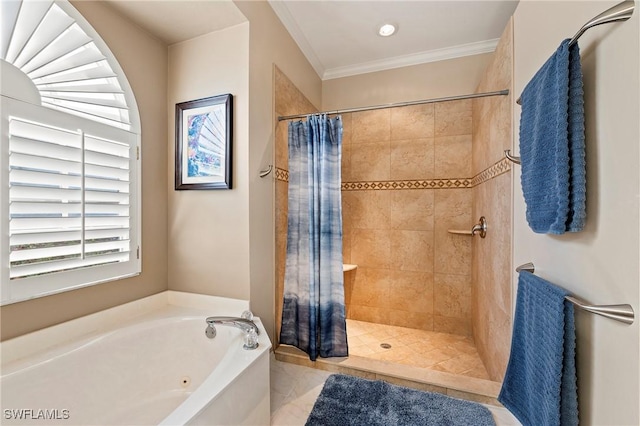 bathroom featuring ornamental molding and shower with separate bathtub