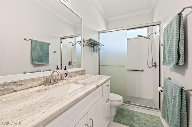 bathroom with vanity, toilet, an enclosed shower, and ornamental molding