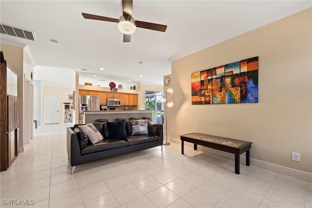 living room with ceiling fan, ornamental molding, and light tile patterned flooring