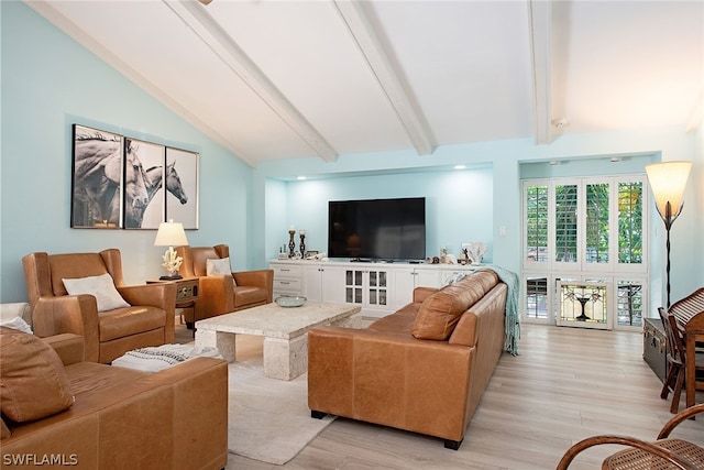 living room with vaulted ceiling with beams and light wood-type flooring