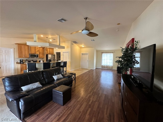 living room featuring high vaulted ceiling, ceiling fan, and light wood-type flooring