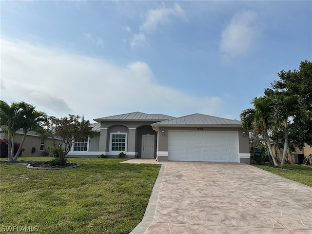 view of front facade featuring a garage and a front lawn