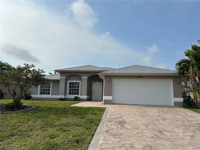 view of front of property with a front yard and a garage