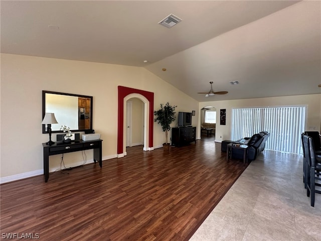 living room with dark wood-type flooring, ceiling fan, and lofted ceiling