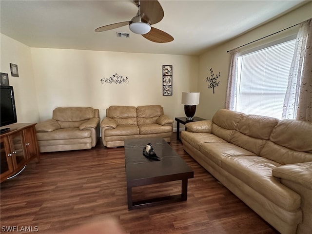 living room with dark hardwood / wood-style floors and ceiling fan