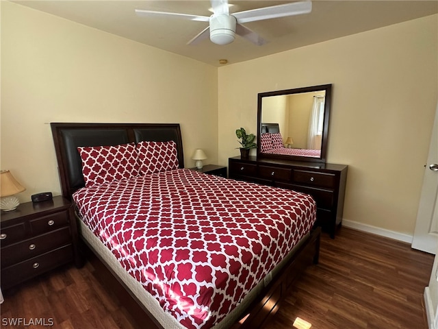 bedroom with dark hardwood / wood-style flooring and ceiling fan