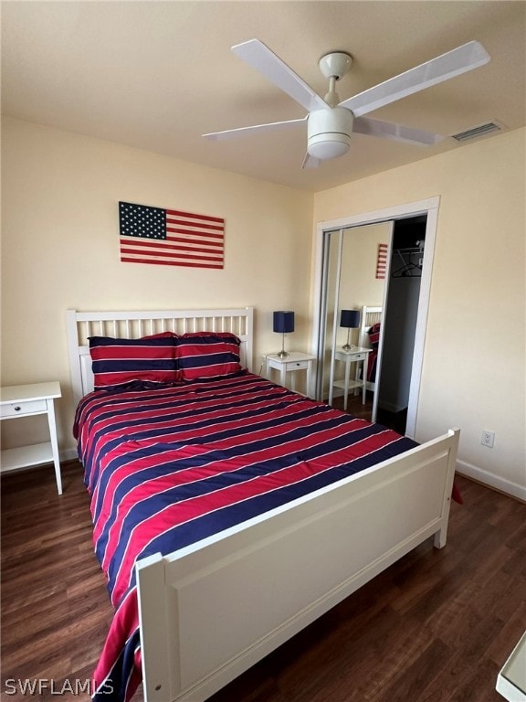 bedroom with a closet, ceiling fan, and dark hardwood / wood-style floors