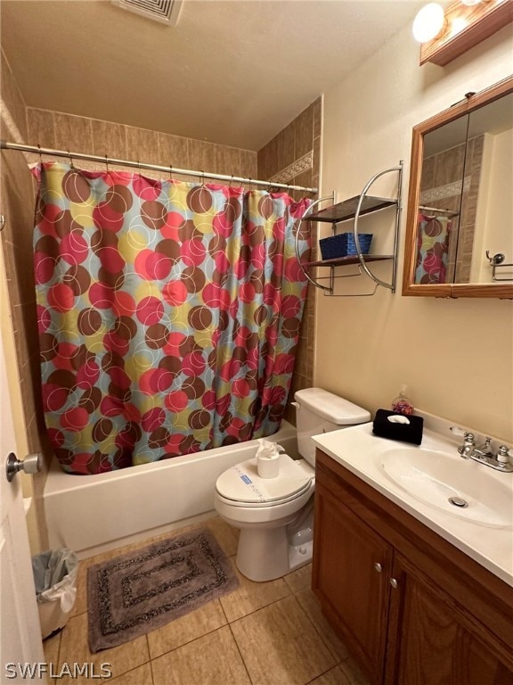 full bathroom featuring vanity, toilet, tile flooring, and shower / bath combo with shower curtain