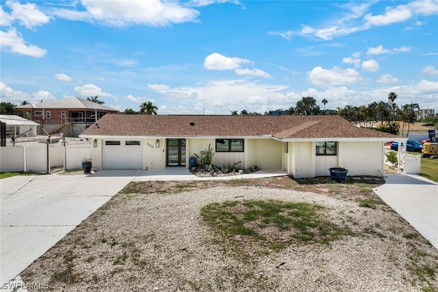 single story home featuring a garage